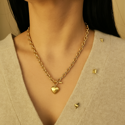 18K gold plated heart necklace worn on a beige sweater, showcasing its charm and elegant design.